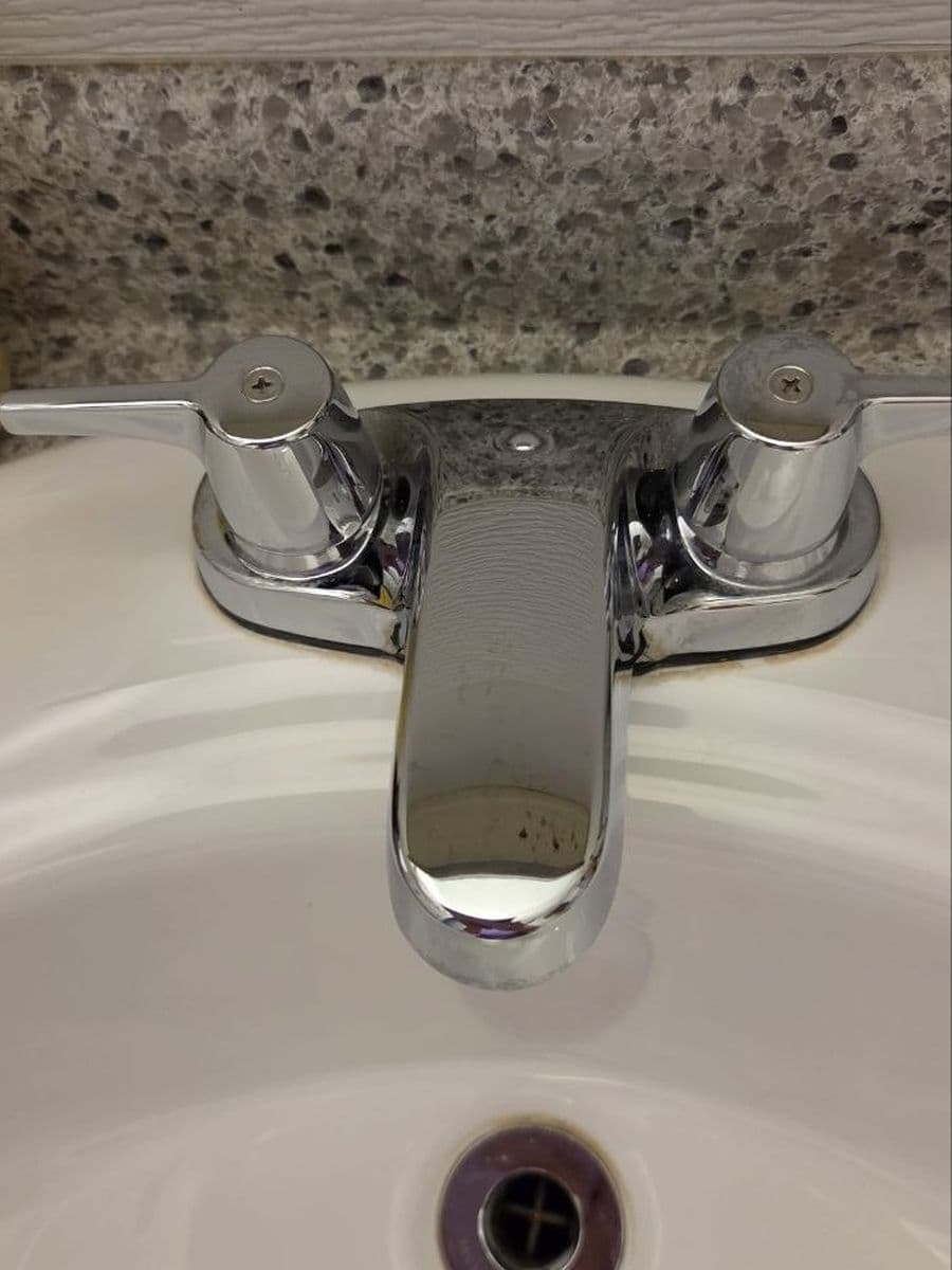 Hard water on chrome after cleaning by Red Deer House Cleaning