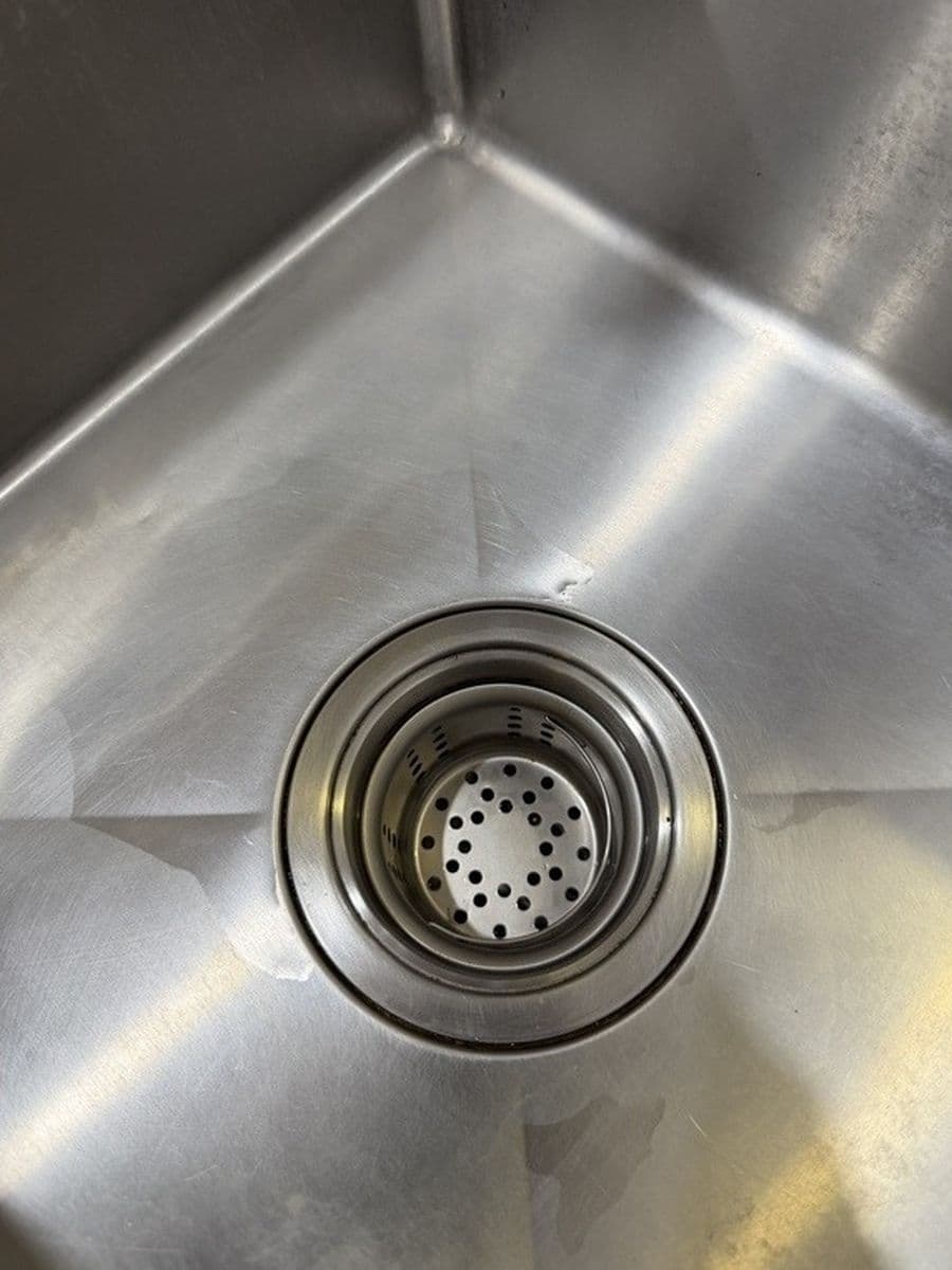 Kitchen sink and drain after cleaning by Red Deer House Cleaning