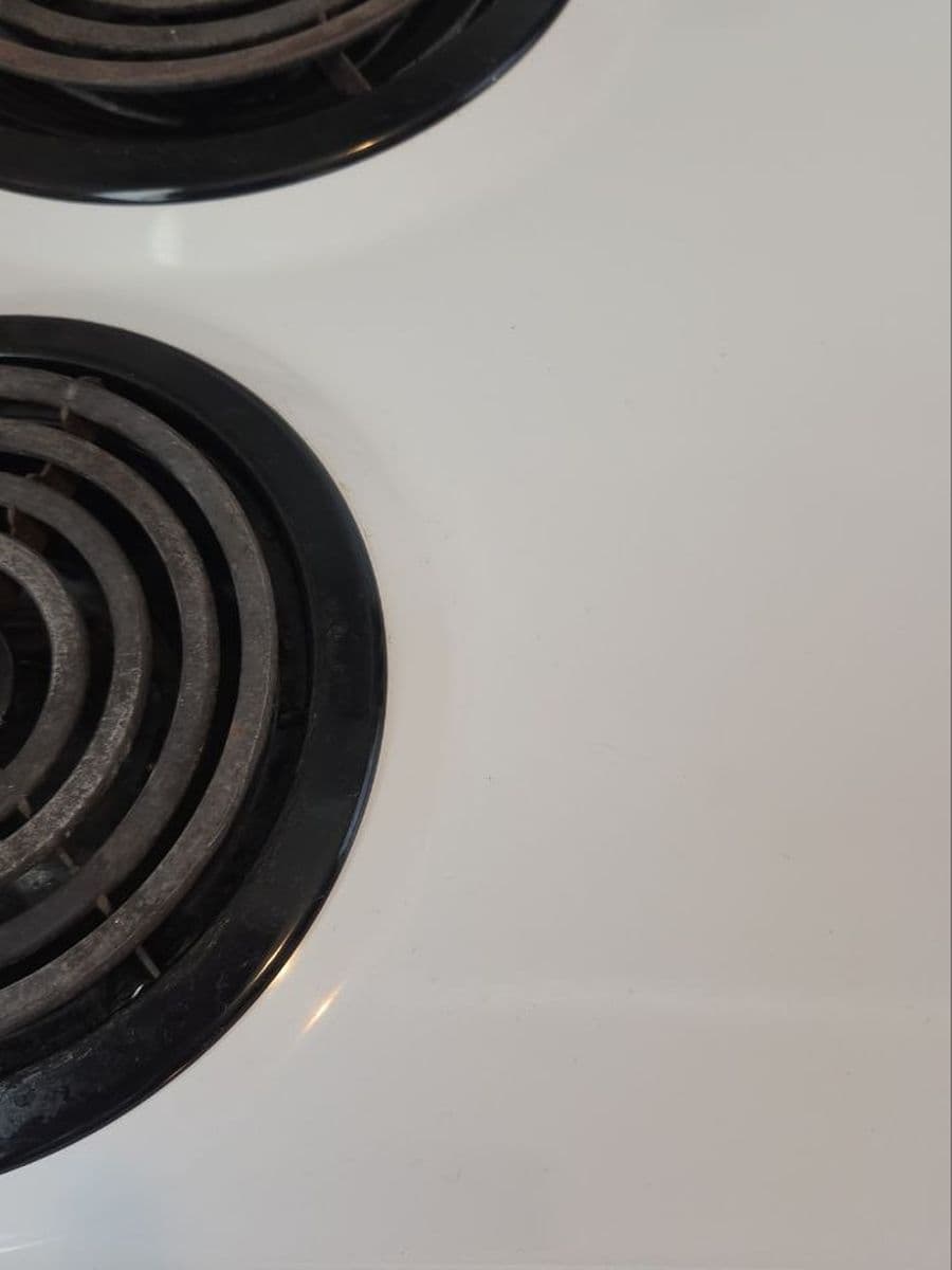 Stove top and drip pans after cleaning by Red Deer House Cleaning