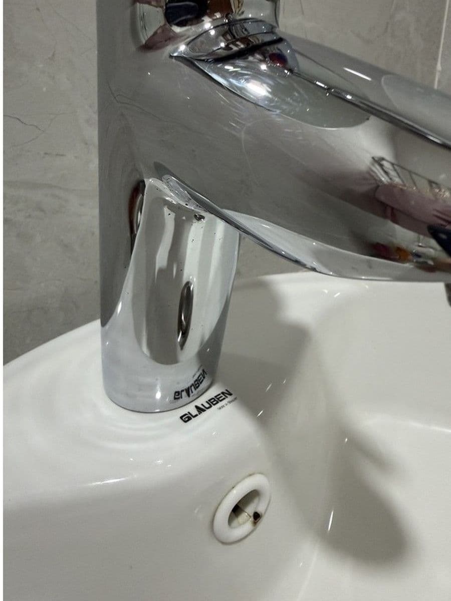 Chrome tap under heavy scale after cleaning by Red Deer House Cleaning