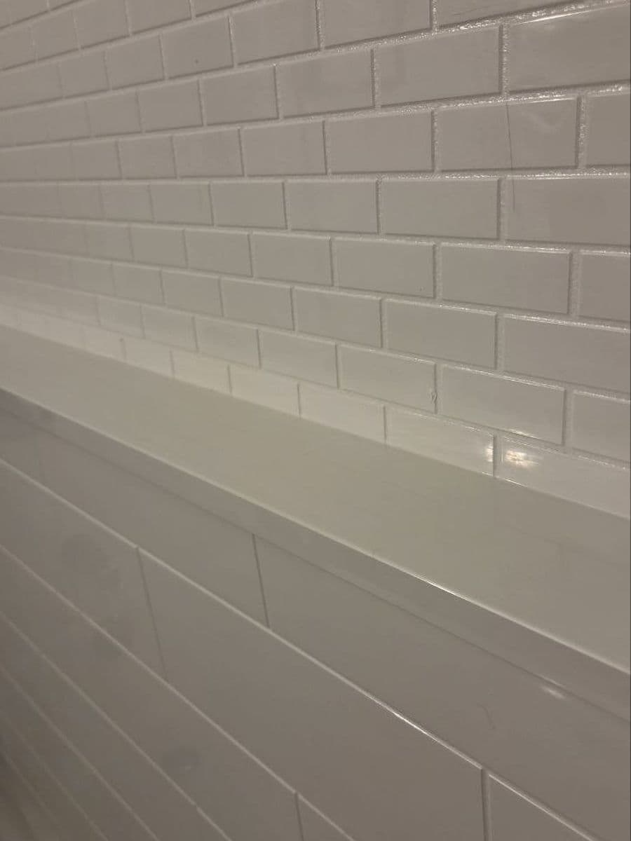 Shower ledge and tile after cleaning by Red Deer House Cleaning