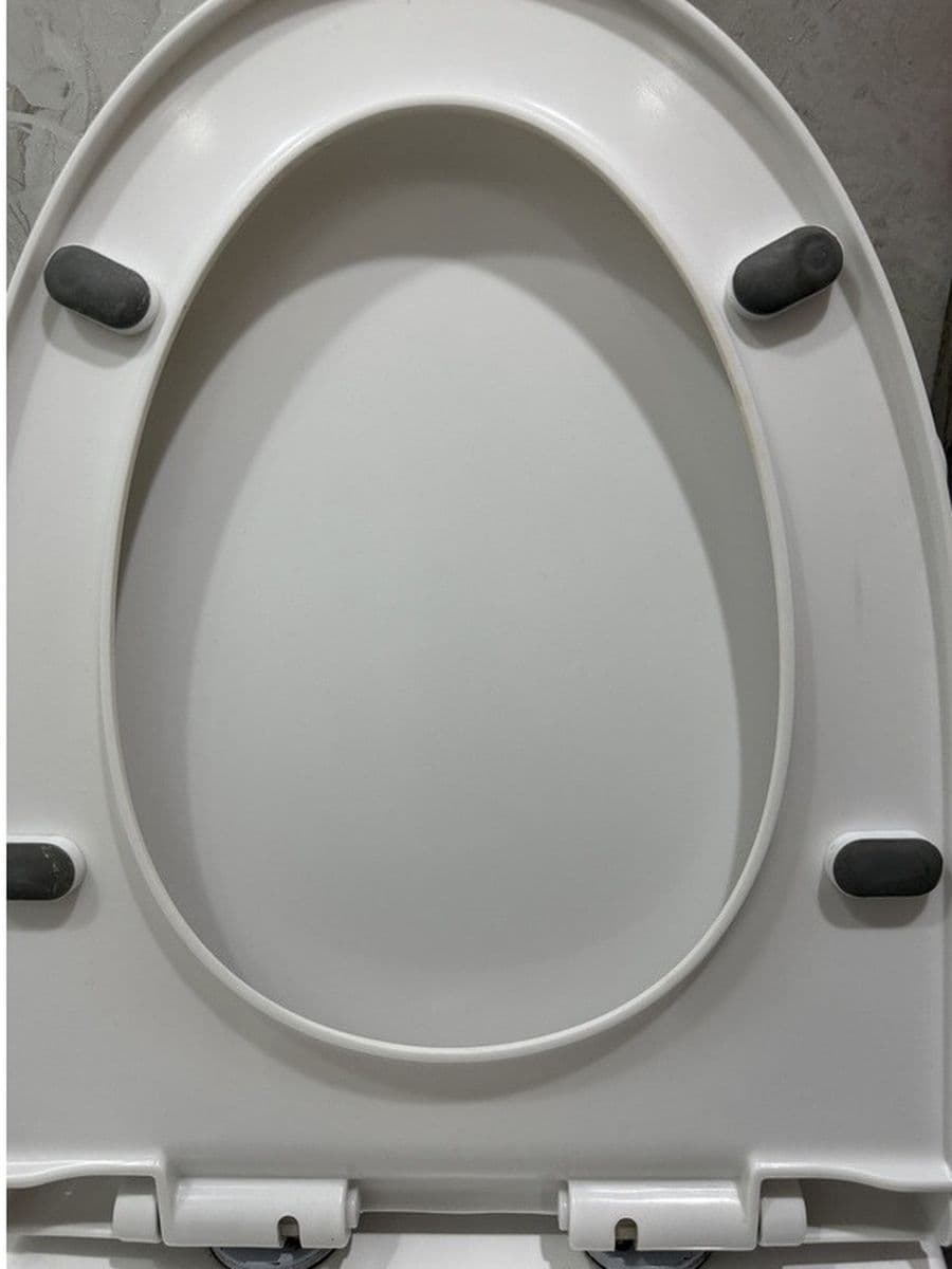 Under the toilet seat after cleaning by Red Deer House Cleaning