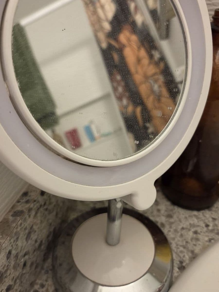 Vanity mirror and base before cleaning by Red Deer House Cleaning