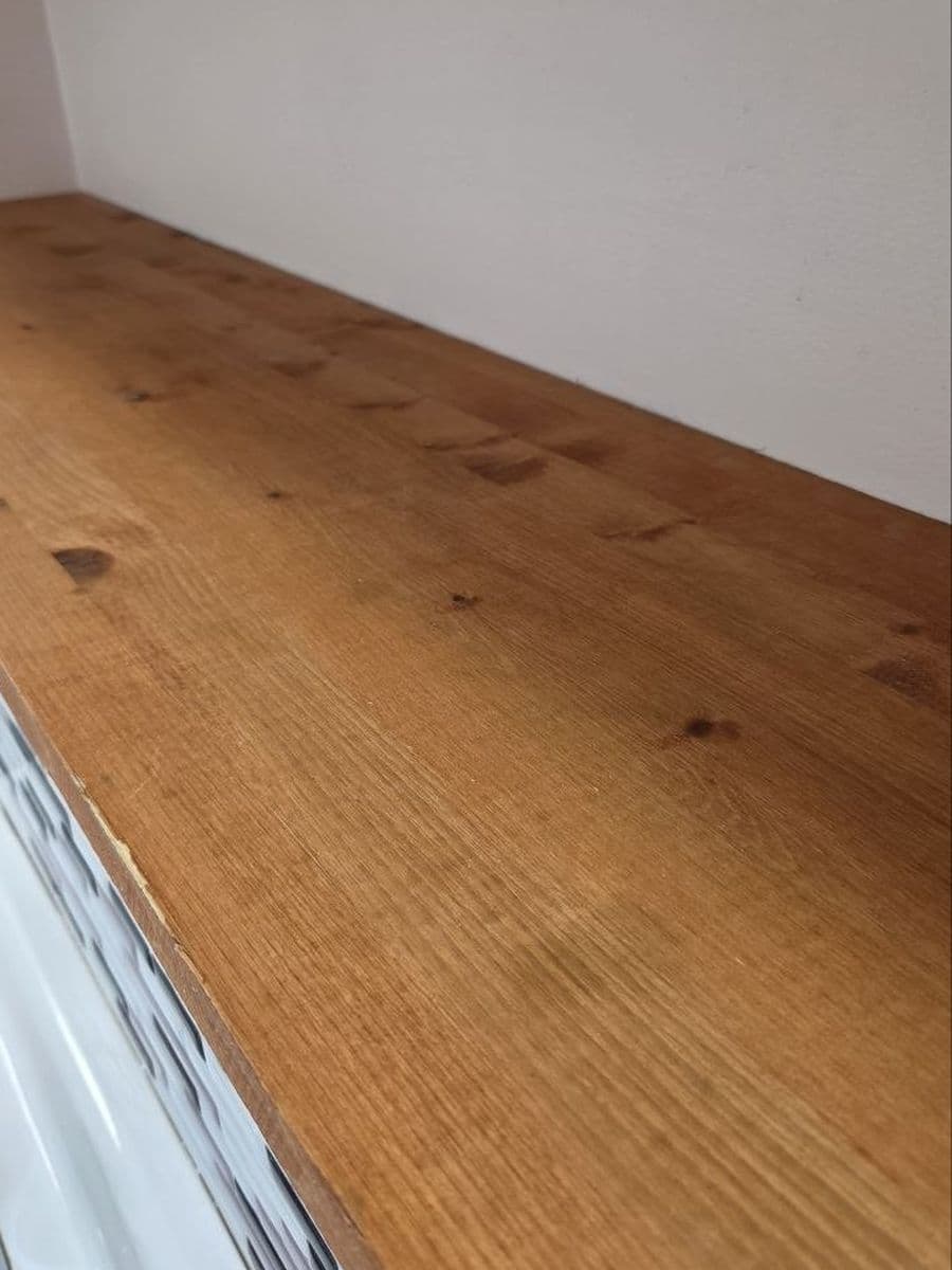 Wood counter with dried splashes after cleaning by Red Deer House Cleaning