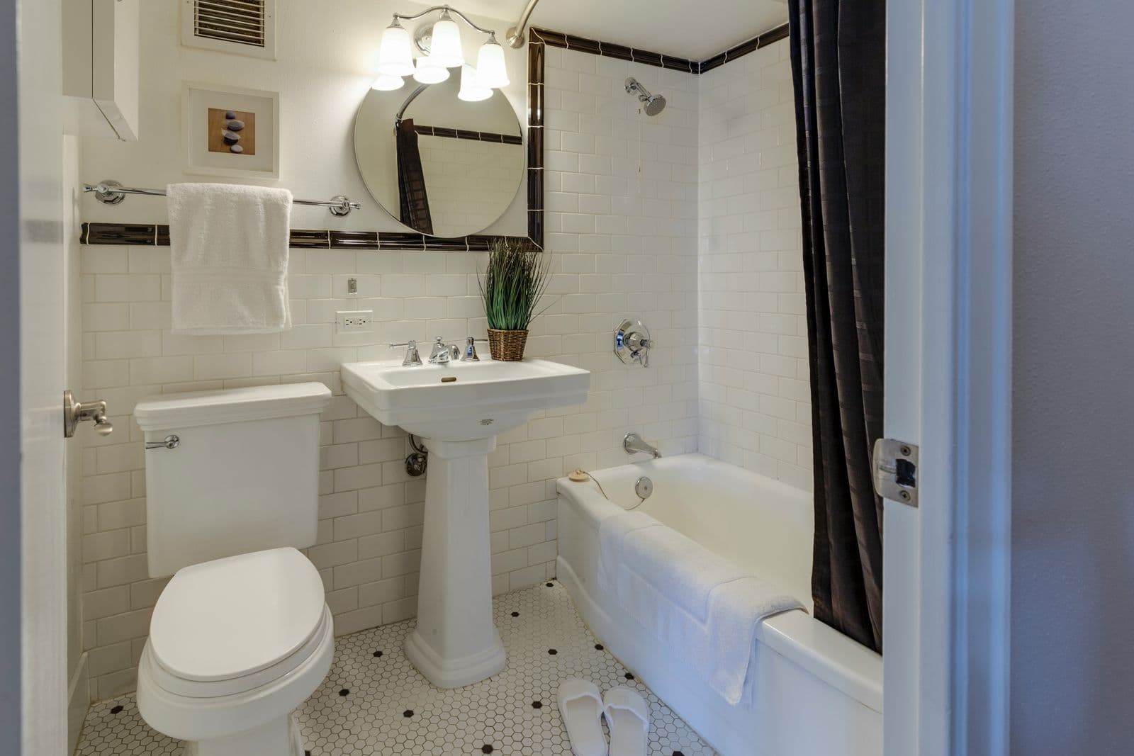 A clean, bright bathroom with fresh towels